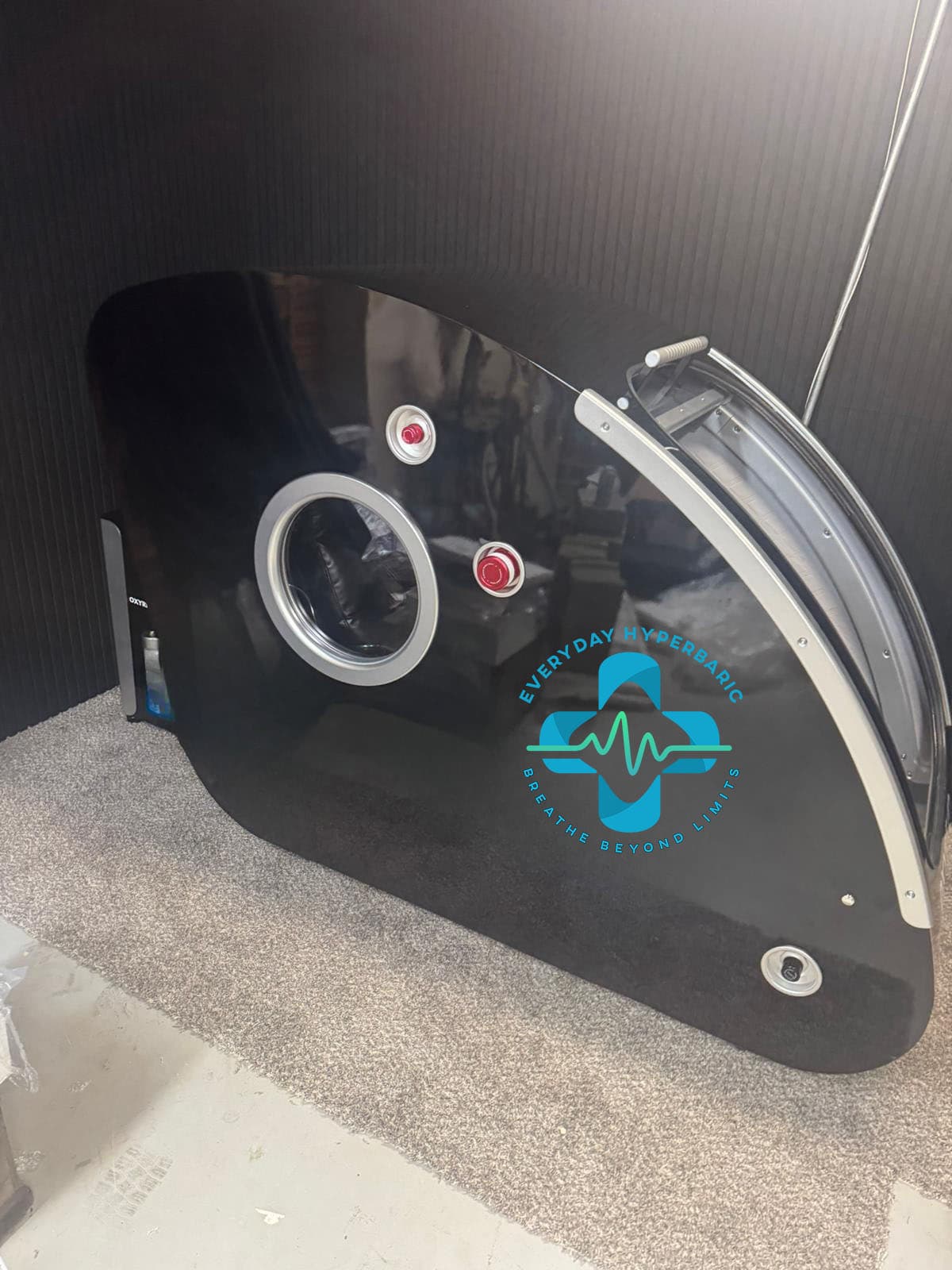 REAL PT & Wellness hardshell HBOT chamber close-up side view showing aviation-grade construction